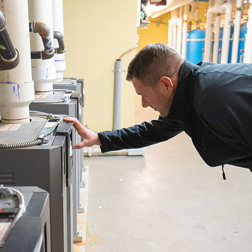 cold pro hvac hydronic man checking equipment